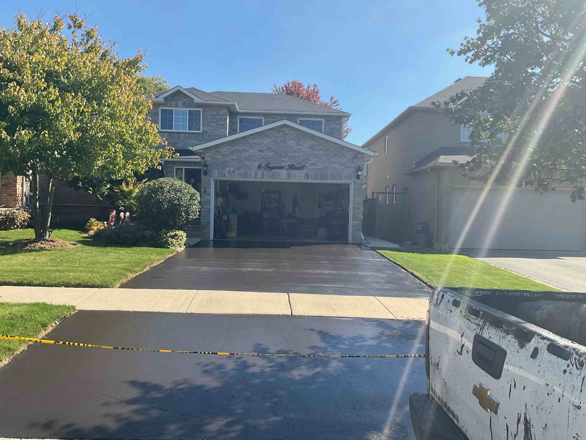 Freshly sealed residential driveway in Hamilton after Pro Seel sealcoating
